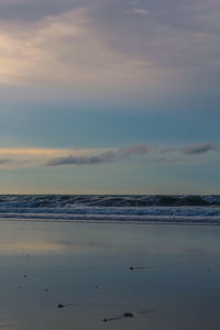 Scenic view of sea against sky at sunset