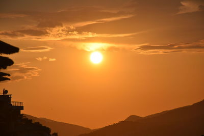 Scenic view of mountains at sunset