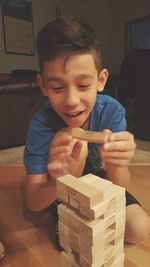 Portrait of boy playing at home