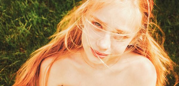 Portrait of beautiful woman in field