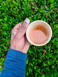 Woman holding coffee cup