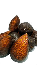 Close-up of oranges against white background