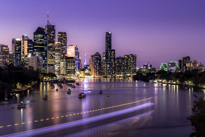 Illuminated buildings in city at night