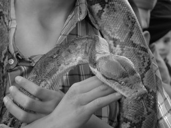 Close-up of man holding hands