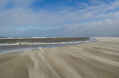 Scenic view of beach against sky