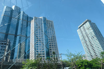 Low angle view of modern buildings against sky