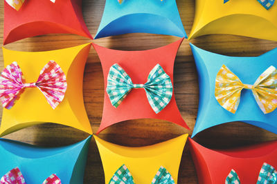 Directly above shot of colorful gift boxes on wooden table