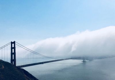 View of suspension bridge in foggy weather