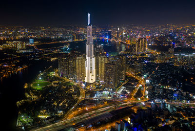 High angle view of illuminated city buildings at night