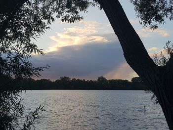 Scenic view of lake against sky during sunset