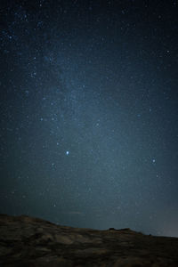 Starry night over cliff