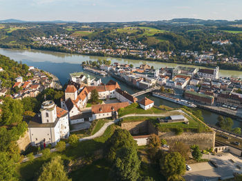 Germany, bavaria, passau, aerial view of veste oberhaus fort with confluence of danube and ilz rivers in background