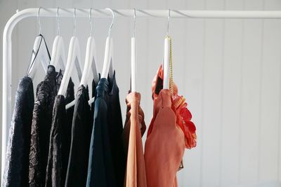 Clothes hanging against wall at home