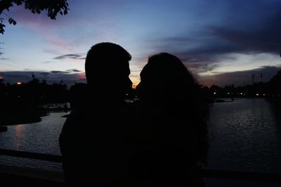 Silhouette of people at sunset