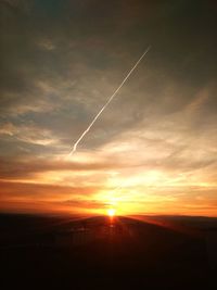 Silhouette landscape against sky at sunset