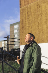 Mature man holding ice-cream