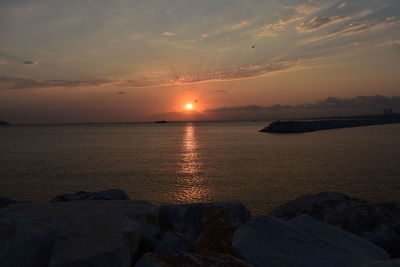 Scenic view of sea against sky during sunset