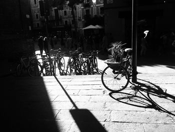 Shadow of bicycle on city