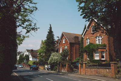 Street amidst buildings against sky