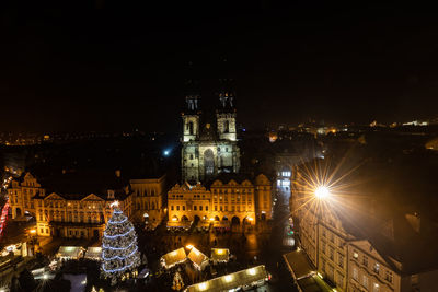 High angle view of illuminated buildings in city at night