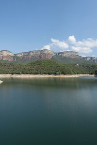 View of lake with buildings in background