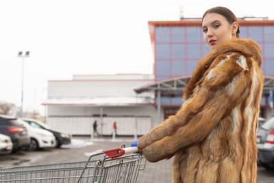 Portrait of woman standing in shopping mall