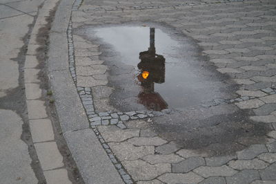 High angle view of puddle on street