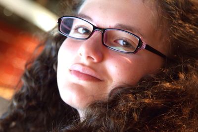 Close-up portrait of teenage girl wearing eyeglasses