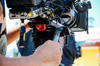 Close-up of man working on machine