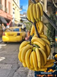 Close-up of yellow fruit on street