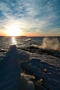 Scenic view of sea against sky at sunset