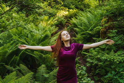 Full length of woman with plants in park