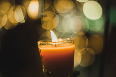 Close-up of lit tea light at home