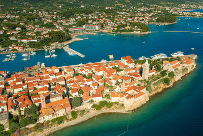 High angle view of townscape by sea