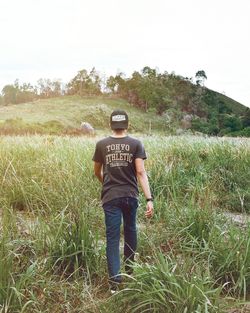 Full length of man standing on field