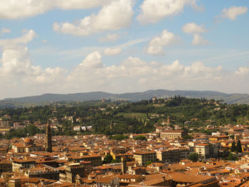 Houses in town against sky
