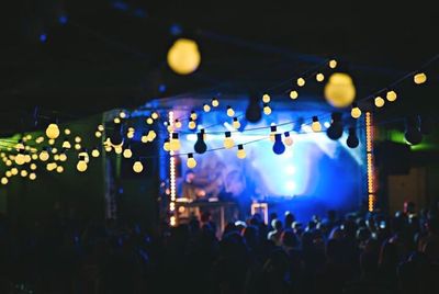 Low angle view of illuminated lights at night