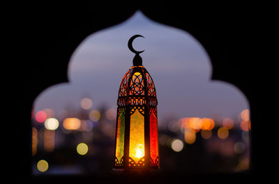 Lantern with moon symbol and mosque shape background. ramadan kareem and islamic new year concept.