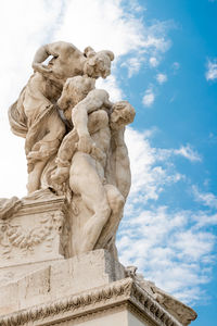 Low angle view of statue against sky