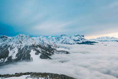 Scenic view of snowcapped mountains against sky