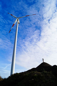 Low section of windmill against sky