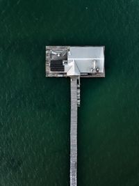 High angle view of house amidst sea