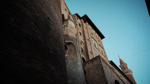 Low angle view of old building against sky