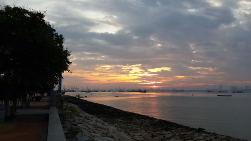 Scenic view of sea against sky at sunset