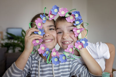 Kids create easter flower wreath in pastel colors using an upcycled egg trail. zero waste lifestyle