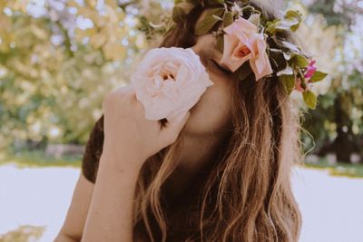 Close-up of beautiful woman with flowers