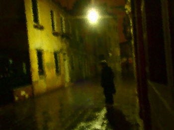 Blurred motion of people walking in the dark