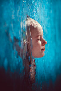 Close-up of boy swimming in pool