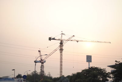 Low angle view of electricity pylon against sky