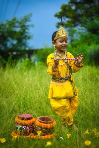 Little boy dressed as lord krishna.